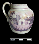 Painted design in pink and purple luster on white bodied small jug.